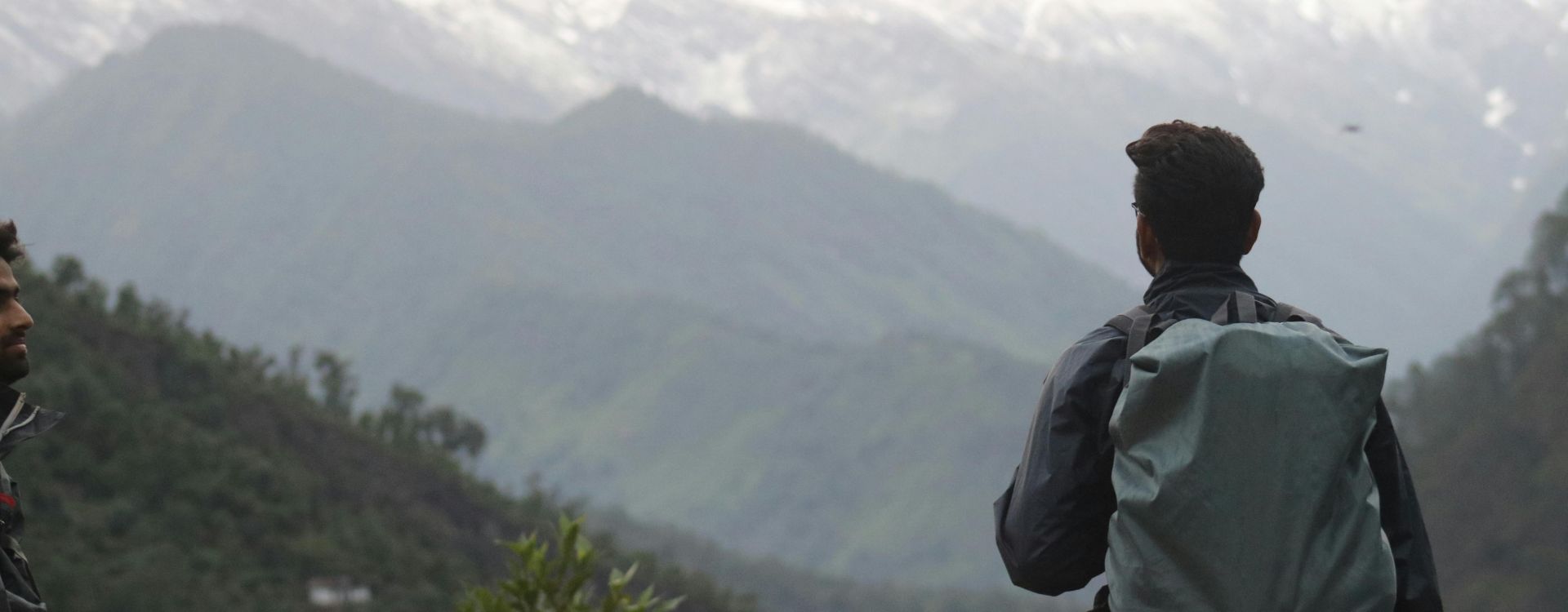 Man With Gray Backpack Across Mountain